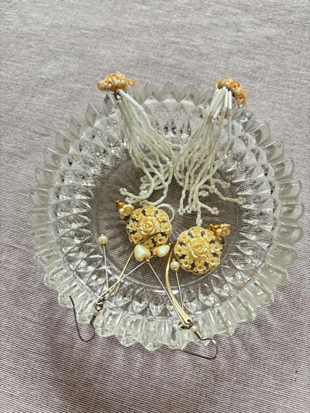 Set of three vintage cream earrings.